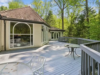 a view of backyard with cabin and wooden floor