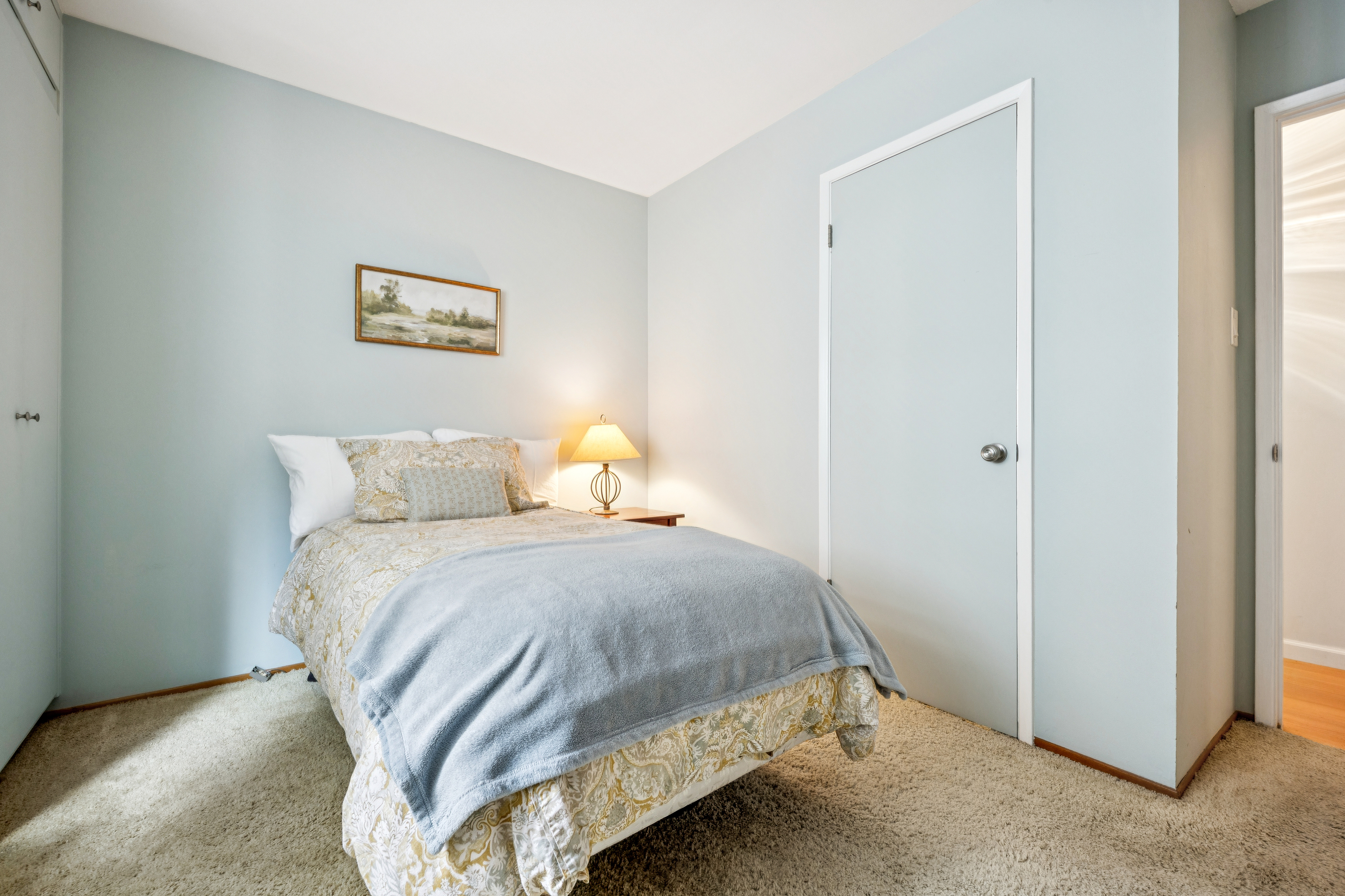 77 Bothin Road Fairfax, CA 94930 - Photo 22 of 32 a bedroom with a bed and painting on the wall