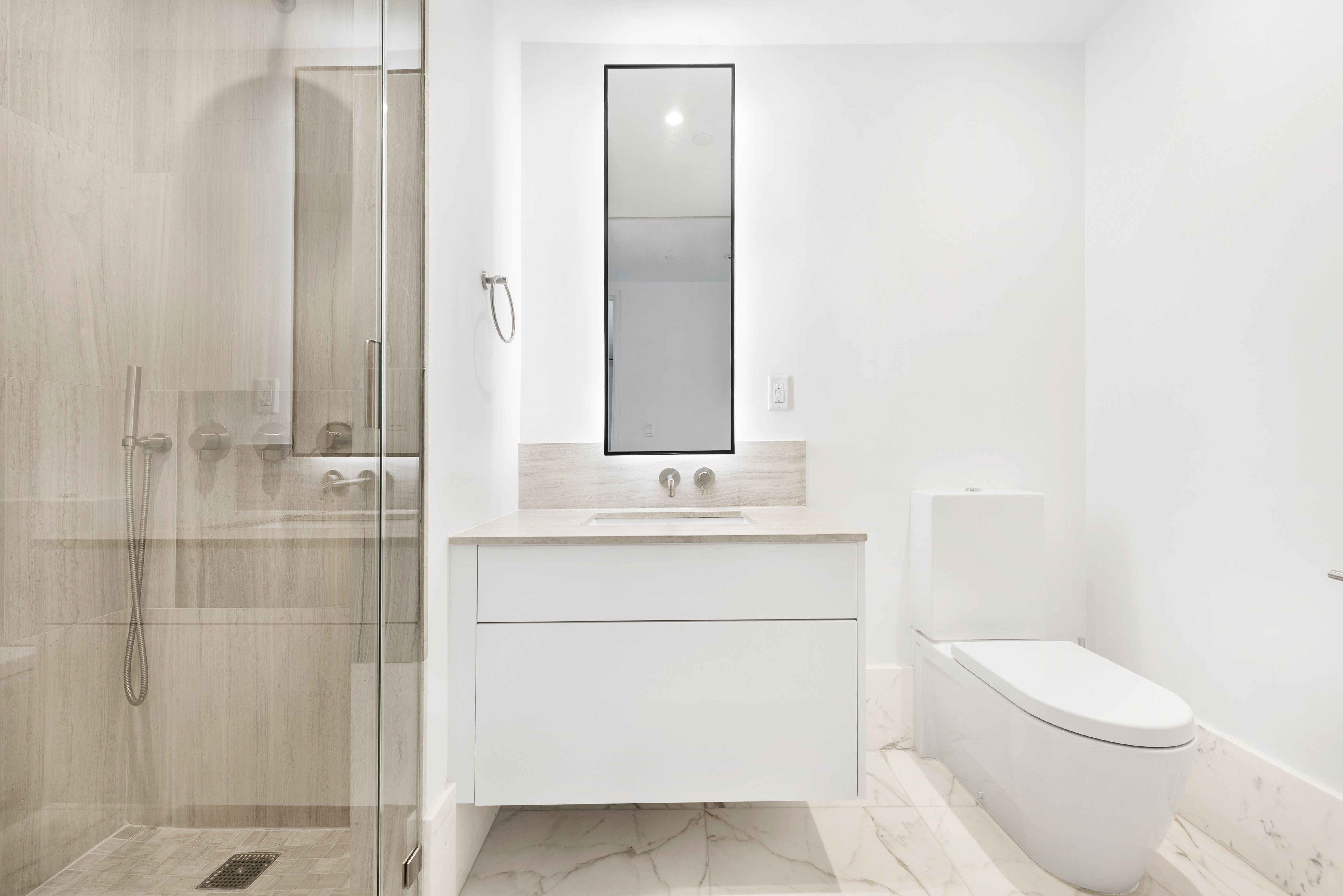 429 Kent Avenue, Unit D726 Brooklyn, NY 11249 - Photo 13 of 21 a bathroom with a sink a toilet and shower