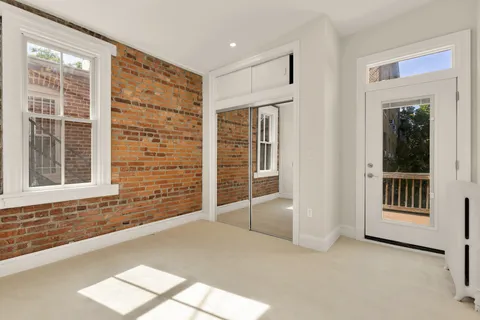 a view of an empty room with a window