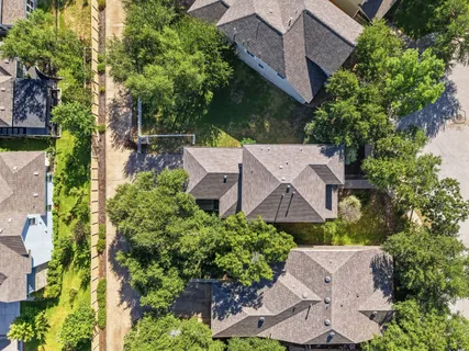 an aerial view of a house with yard swimming pool and outdoor seating