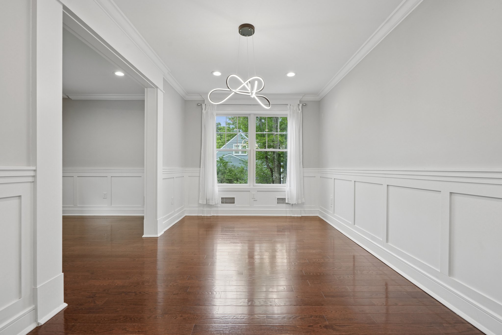 823 River Road Chatham, NJ 07928 - Photo 35 of 60 an empty room with wooden floor and windows