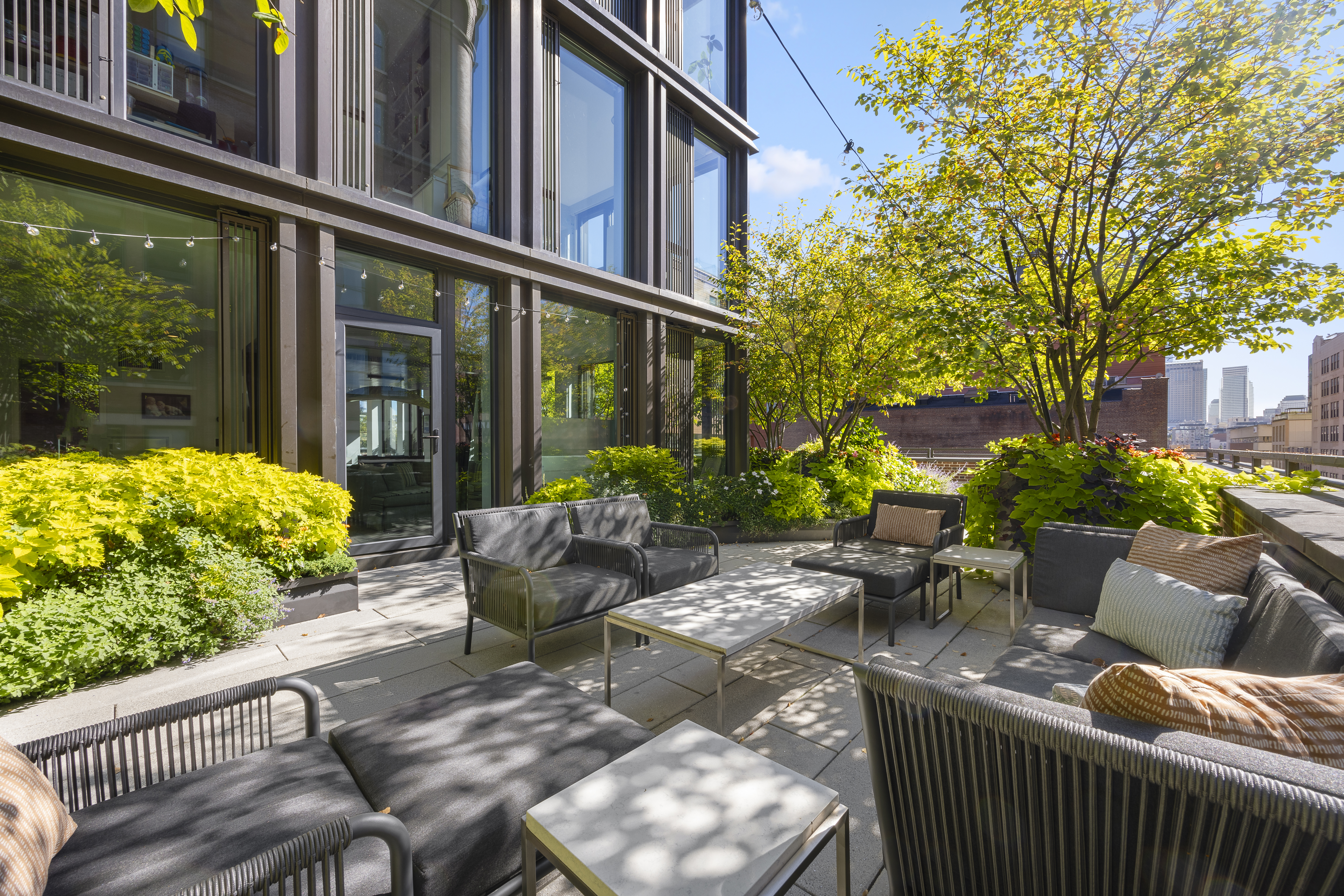 100 Barrow Street, Unit 7/8A Manhattan, NY 10014 - Photo 8 of 23 a view of a patio with couches table and chairs and potted plants