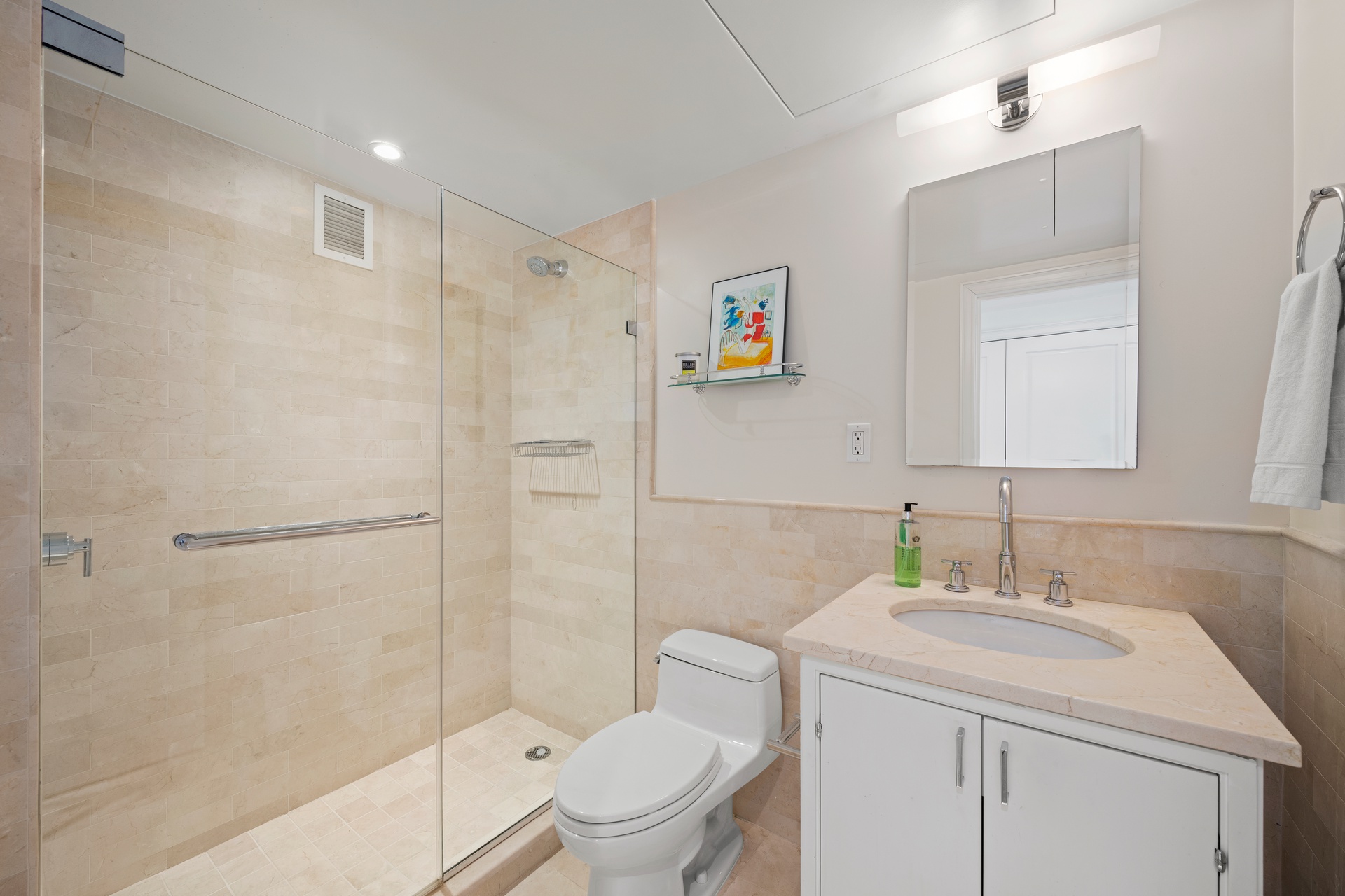 200 East 66th Street, Unit D1205 Manhattan, NY 10065 - Photo 16 of 33 a bathroom with a granite countertop sink toilet and shower