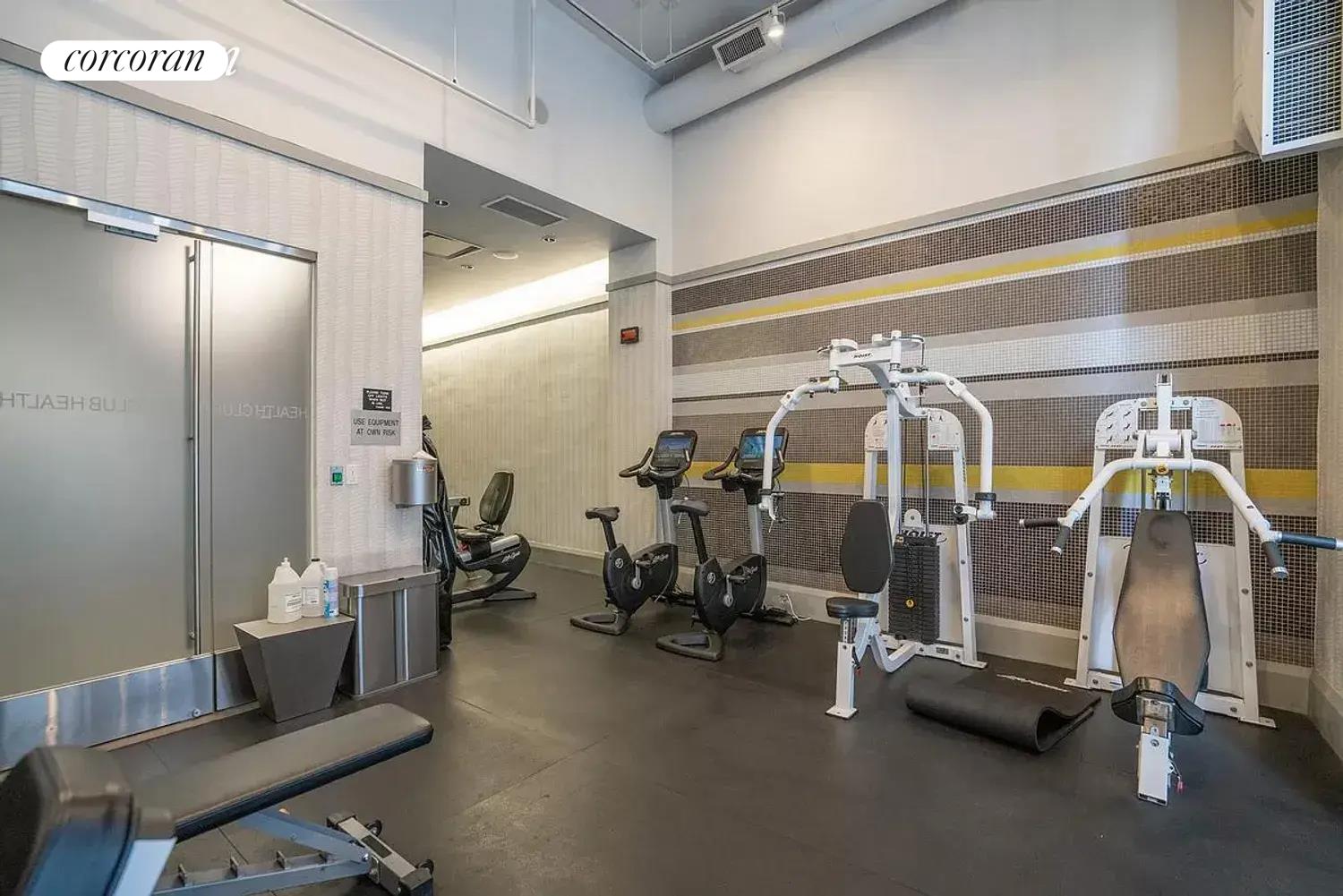 150 Nassau Street, Unit 8K Manhattan, NY 10038 - Photo 6 of 8 a view of a room with gym equipment