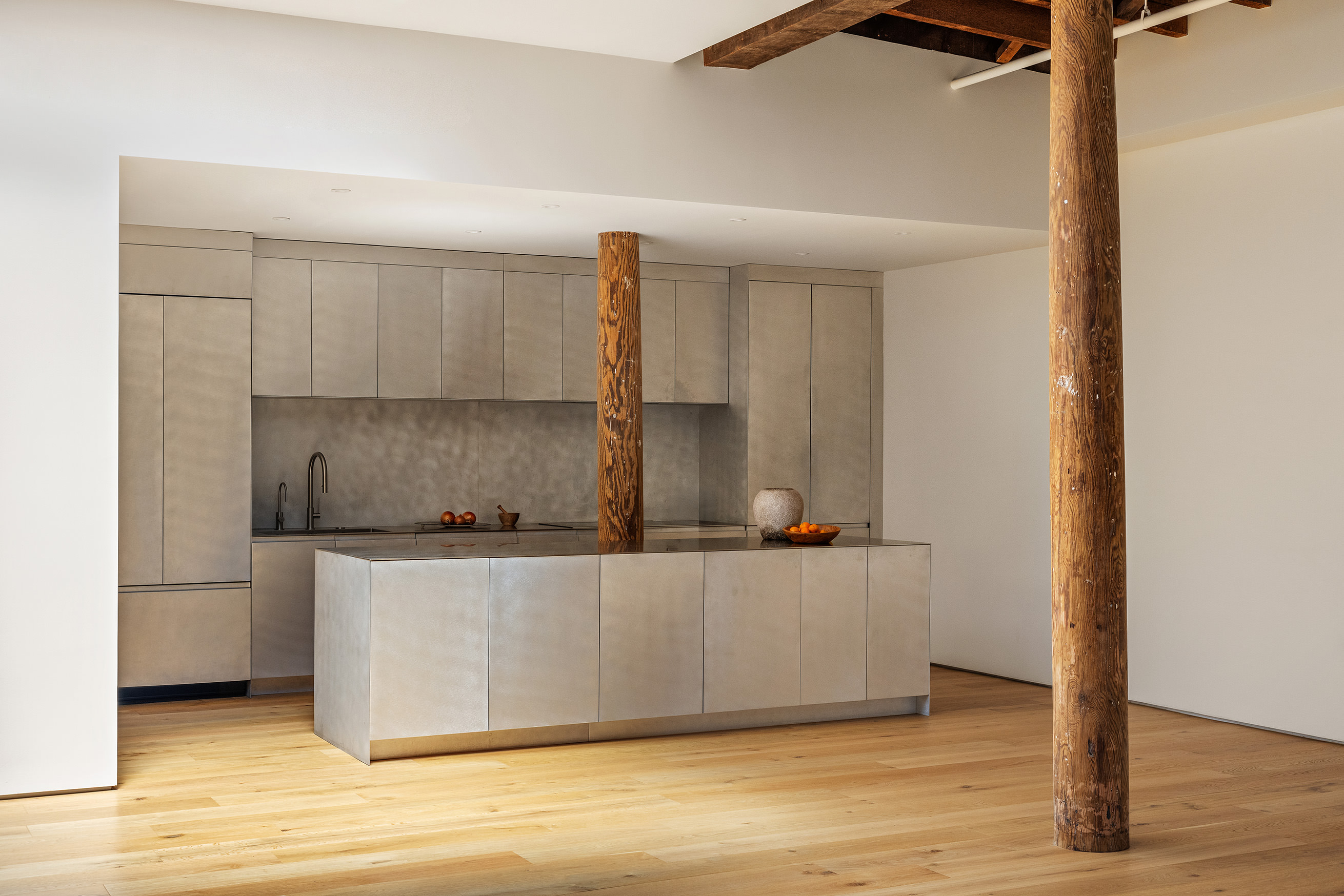 477 Broome Street Manhattan, NY 10013 - Photo 5 of 18 a kitchen with stainless steel appliances a refrigerator and a stove
