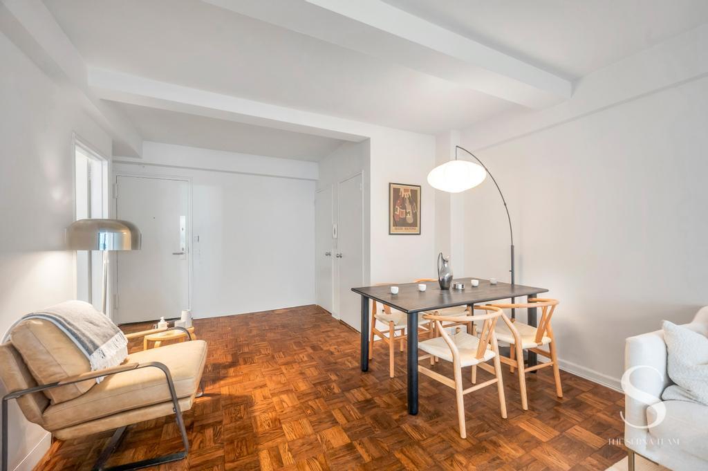 7 Lexington Avenue, Unit 5E Manhattan, NY 10010 - Photo 10 of 27 a view of a livingroom with furniture and chandelier