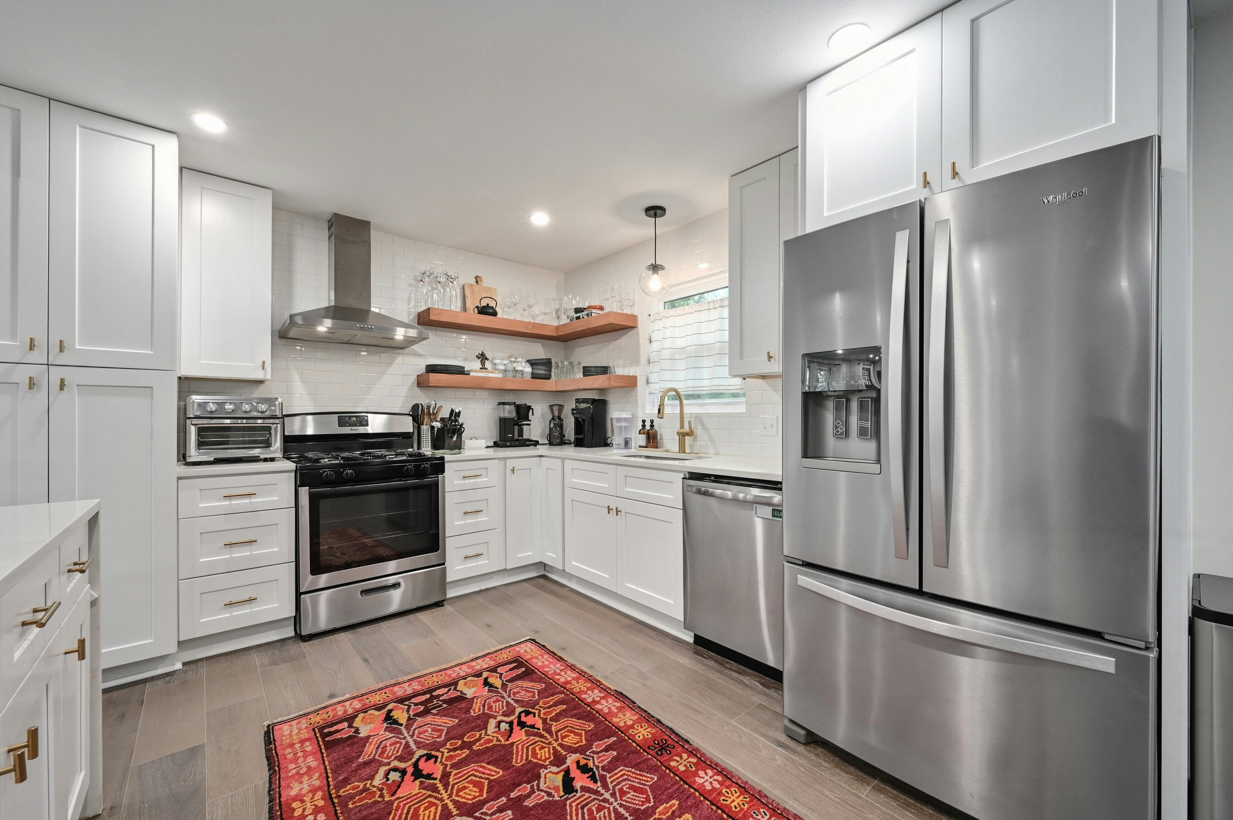 Address Upon Request Austin, TX 78745 - Photo 6 of 19 a kitchen with stainless steel appliances and wooden floor
