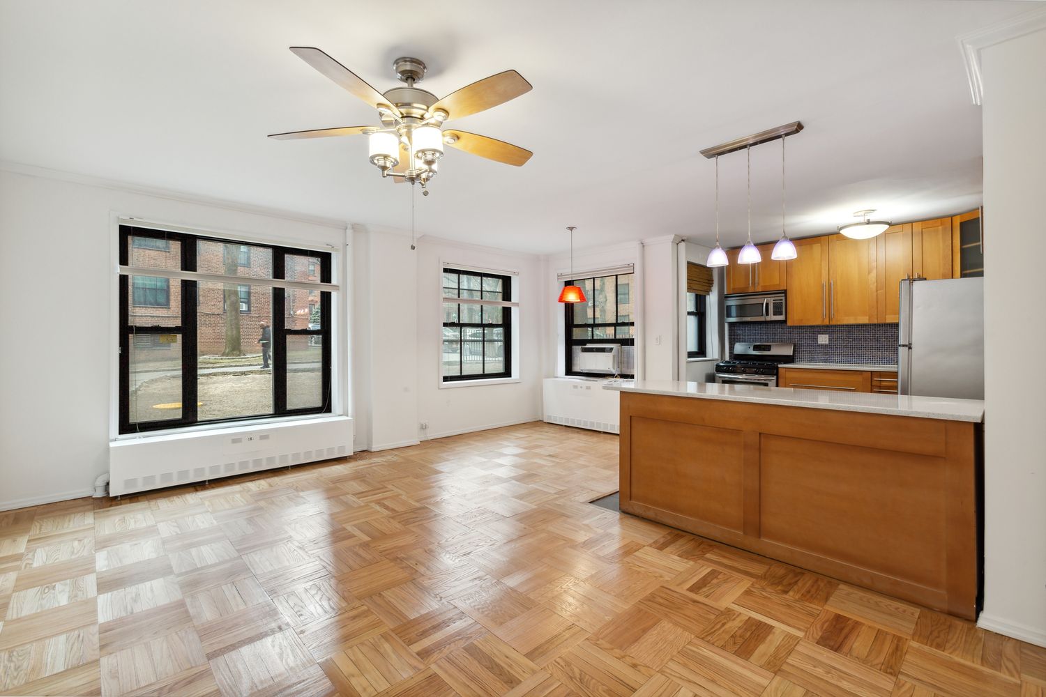 355 Clinton Avenue, Unit 1F Brooklyn, NY 11238 - Photo 2 of 14 a view of kitchen with cabinets and window