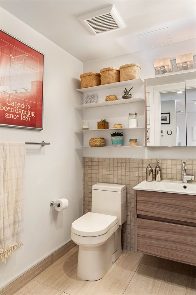 954 Bergen Street, Unit 5D Brooklyn, NY 11216 - Photo 5 of 6 a bathroom with a toilet a sink and mirror