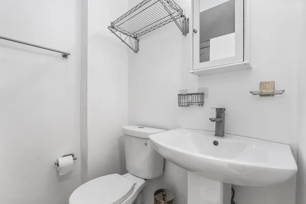 a bathroom with a sink and mirror