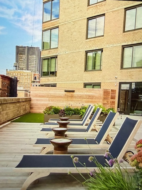 40 East 94th Street, Unit 6F Manhattan, NY 10128 - Photo 16 of 17 a view of swimming pool with outdoor seating