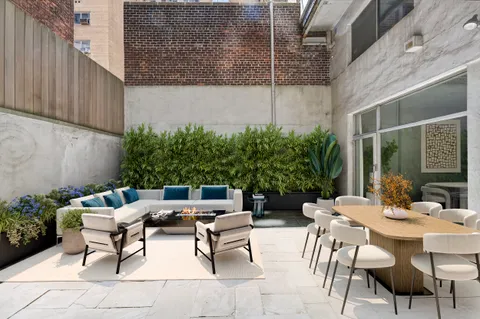 a view of a patio with a table and chairs in patio