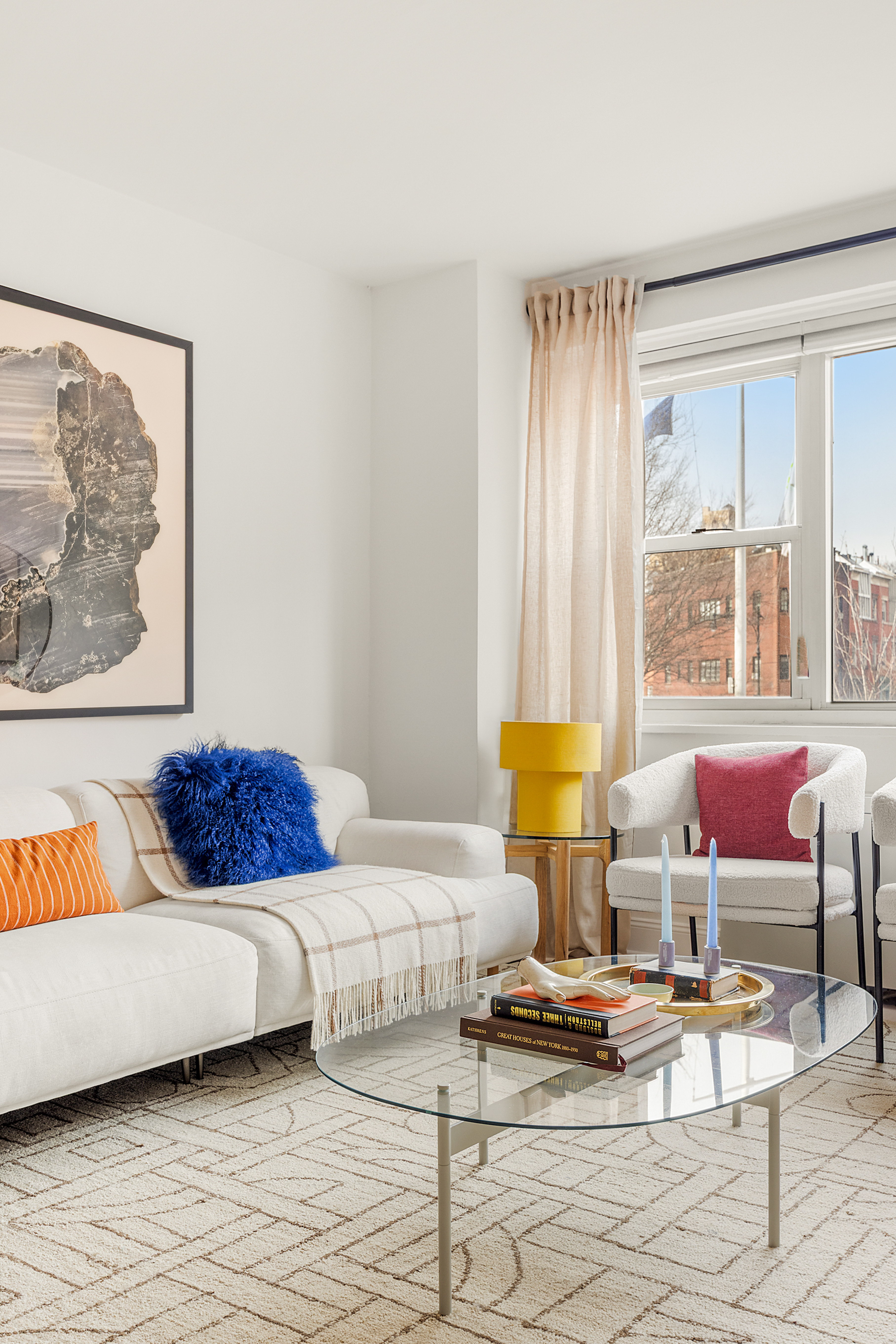 15 Charles Street, Unit 2H Manhattan, NY 10014 - Photo 6 of 12 a living room with furniture and a table
