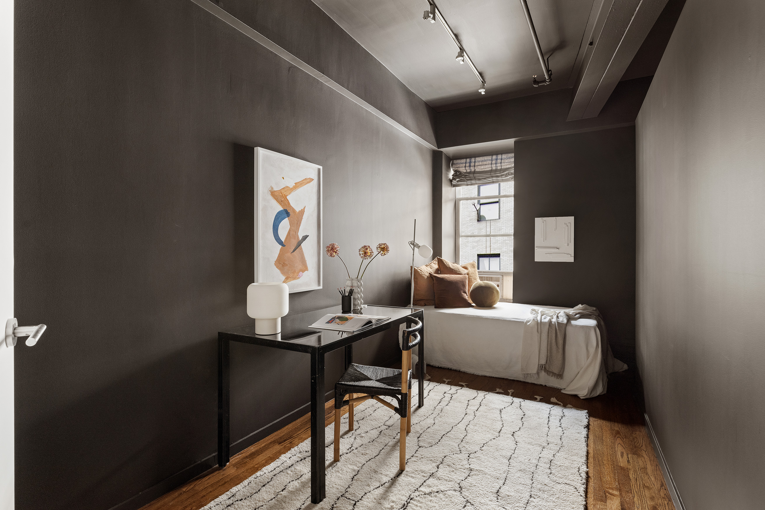 214 West 17th Street, Unit 4B Manhattan, NY 10011 - Photo 5 of 10 a living room with furniture and a window