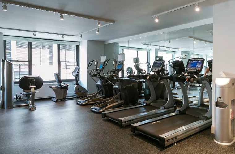 117 East 57th Street, Unit 35D Manhattan, NY 10022 - Photo 24 of 30 a view of a room with gym equipment