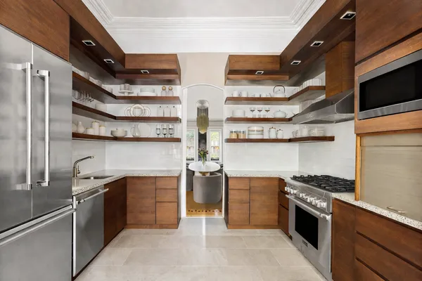 a kitchen with stainless steel appliances granite countertop a stove and a sink