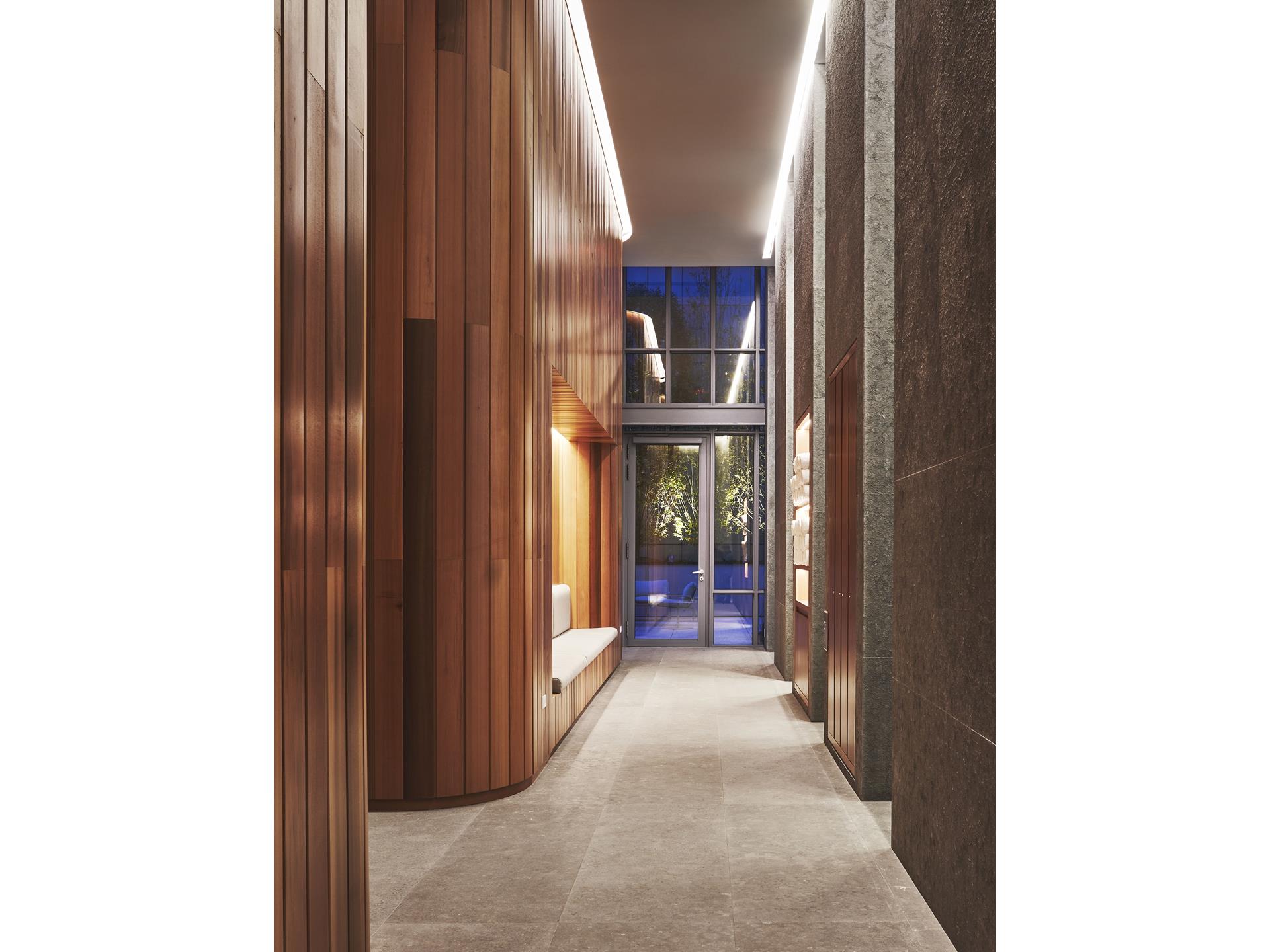 565 Broome Street, Unit N12E Manhattan, NY 10013 - Photo 15 of 19 a view of a hallway with wooden shelves