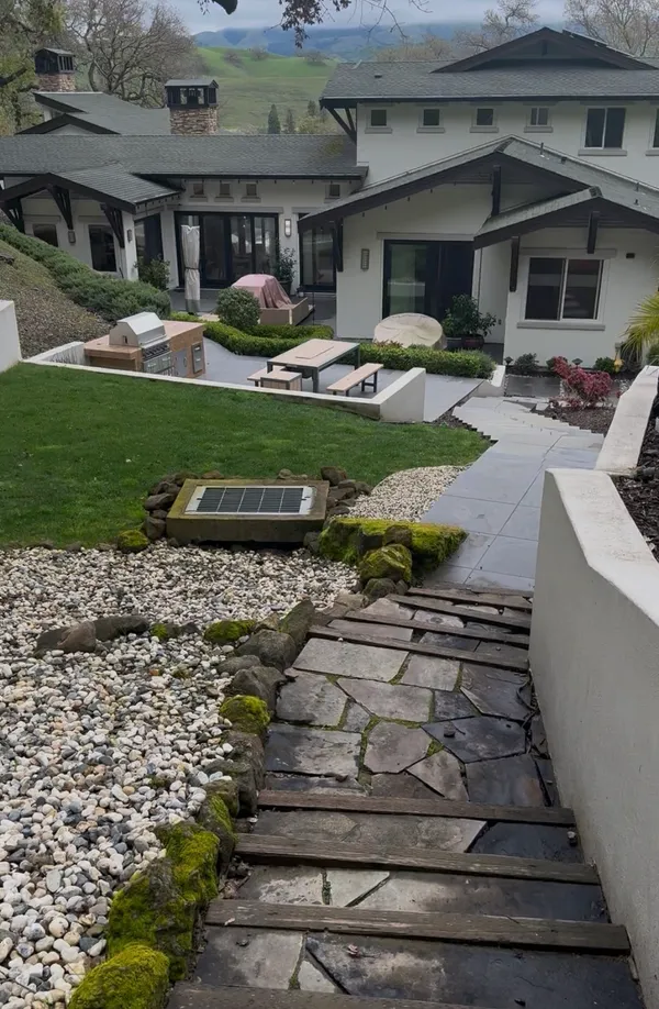 a front view of house with yard and seating area