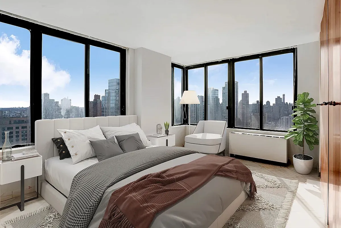 300 East 93rd Street, Unit 35D Manhattan, NY 10128 - Photo 2 of 13 a bedroom with a large bed and a large window