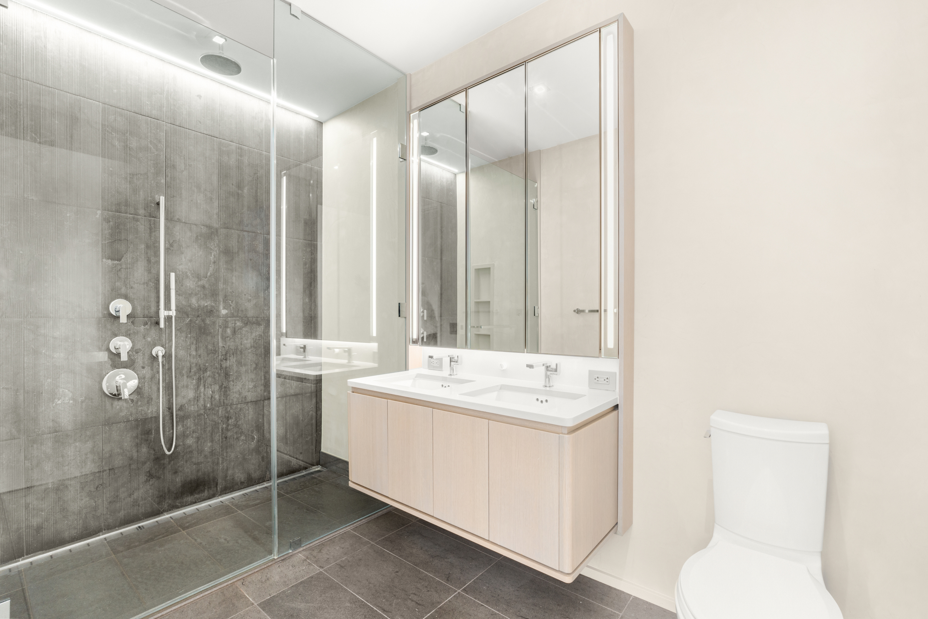 77 Charlton Street, Unit S10A Manhattan, NY 10014 - Photo 8 of 27 a bathroom with a sink a toilet and shower