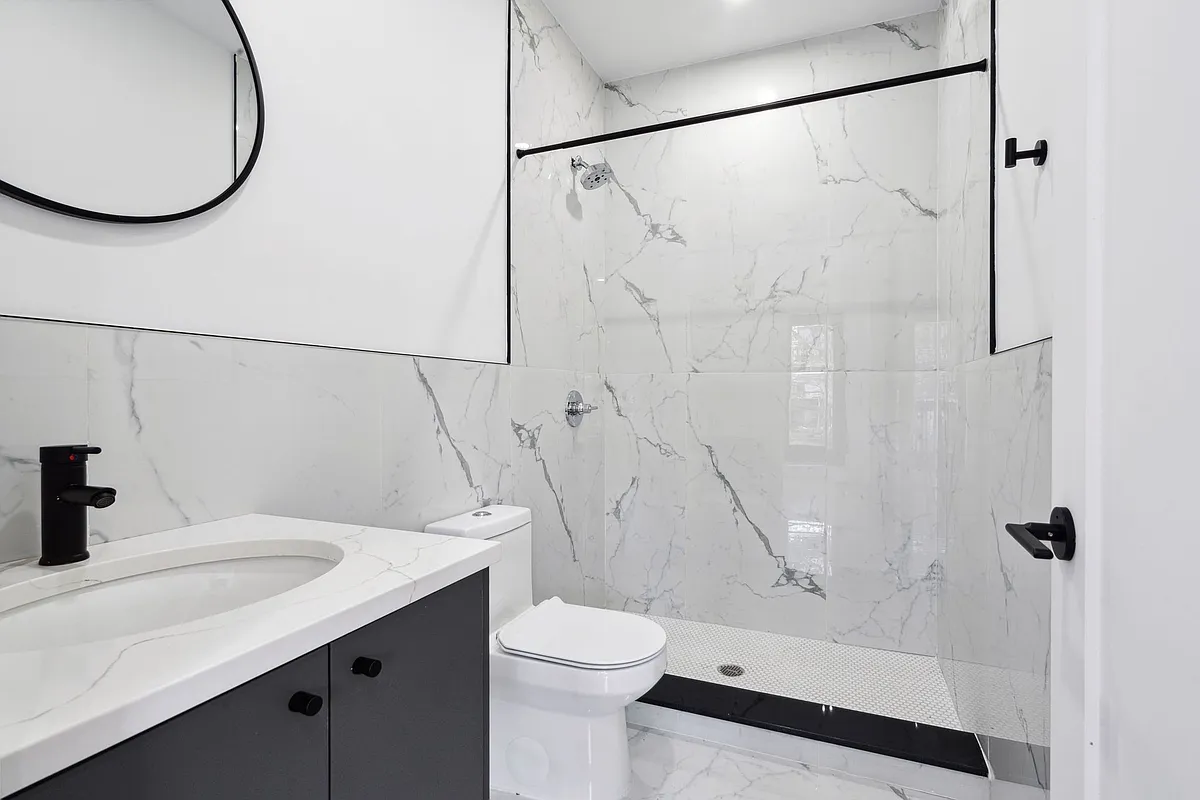 203 Cornelia Street, Unit 2 Brooklyn, NY 11221 - Photo 5 of 9 a bathroom with a sink a toilet and shower