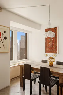 a kitchen with a table and chairs