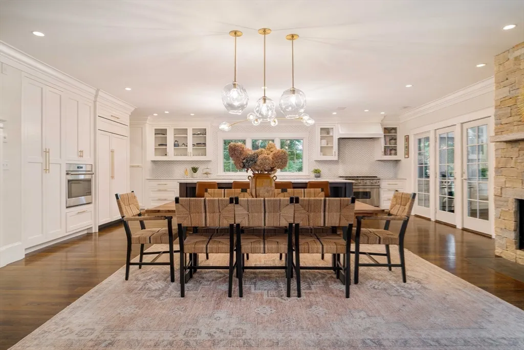 a view of a dining room with furniture wooden floor and chandelier