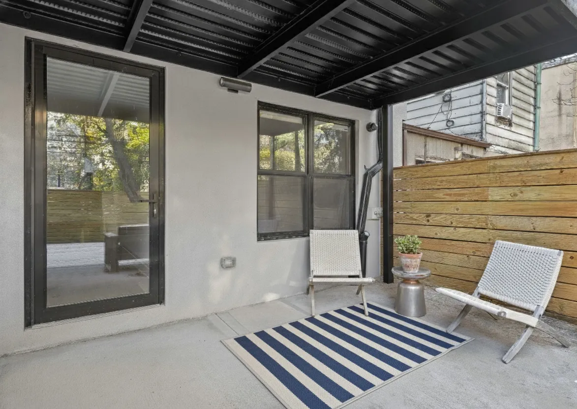 a balcony view with a outdoor seating space