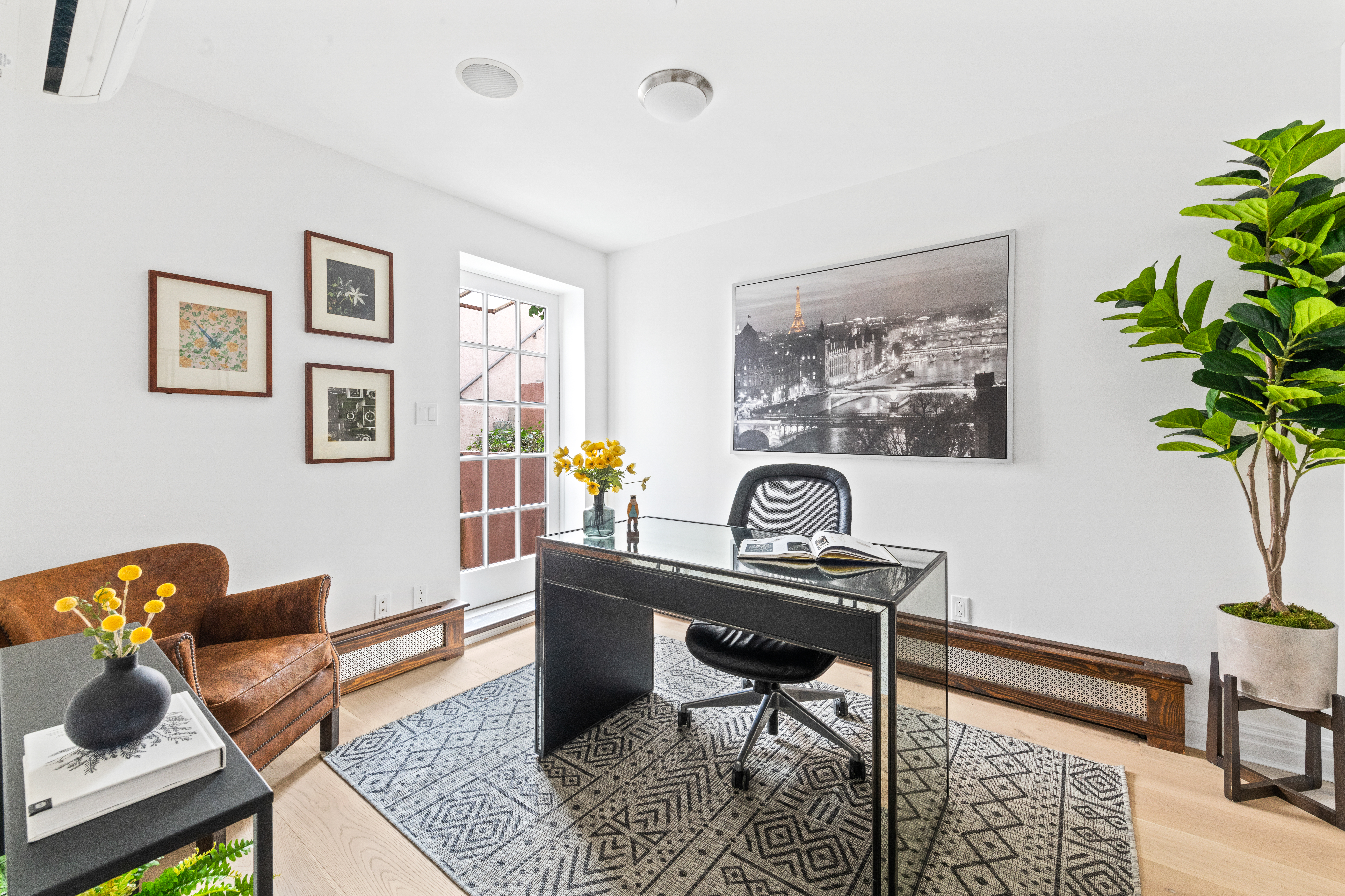 37 Powers Street, Unit 1A Brooklyn, NY 11211 - Photo 6 of 9 a view of a workspace with furniture and a potted plant