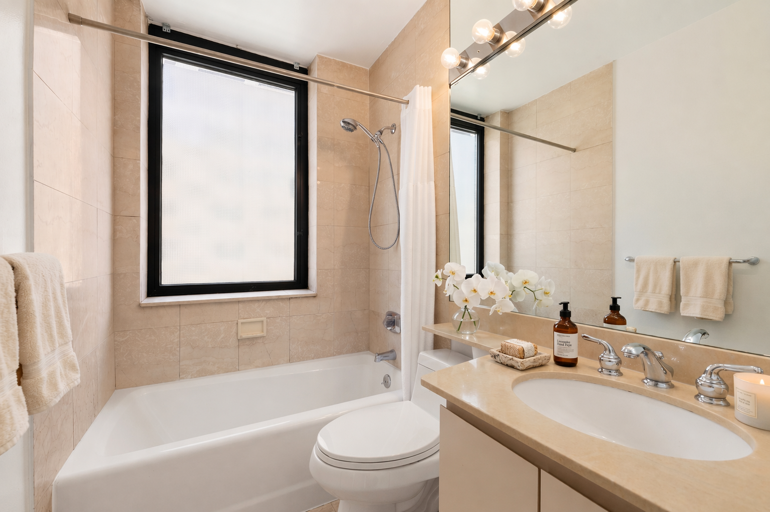 330 East 75th Street, Unit 3B Manhattan, NY 10021 - Photo 9 of 10 a bathroom with a granite countertop sink toilet and shower