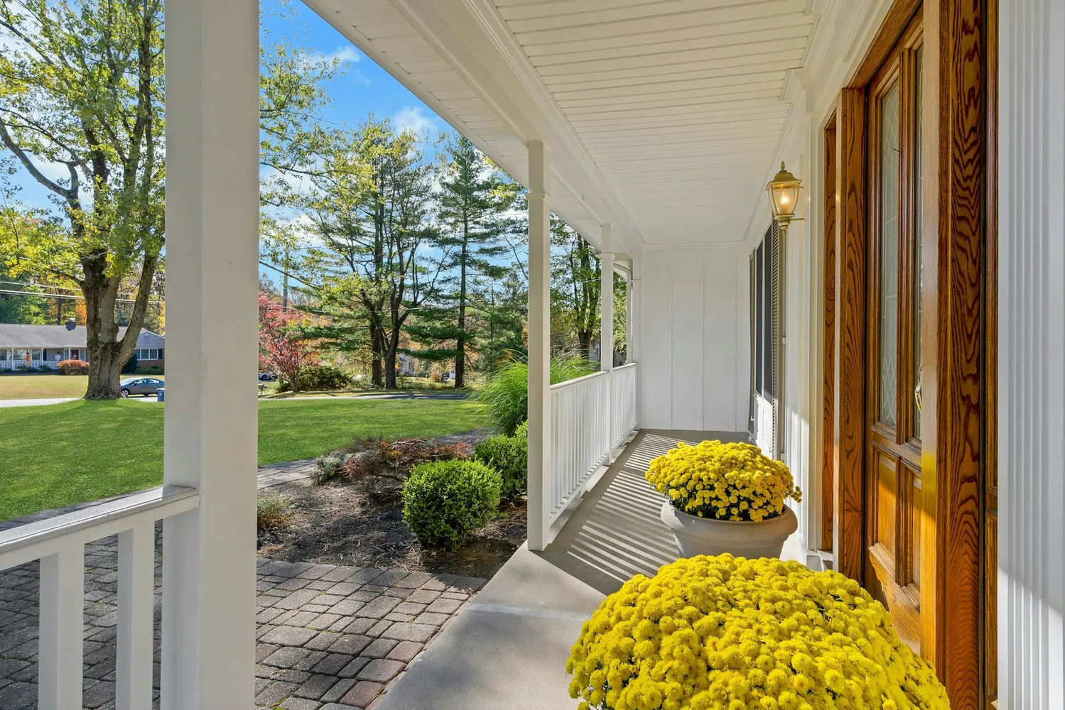 an aerial view of a house with swimming pool and a yard