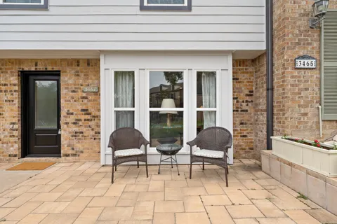 a view of an house with backyard porch and sitting area