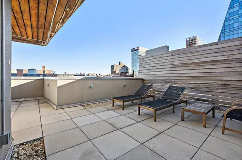 a view of a terrace with chairs