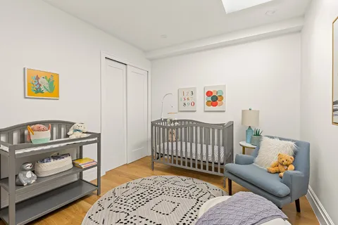 a bedroom with furniture and a rug