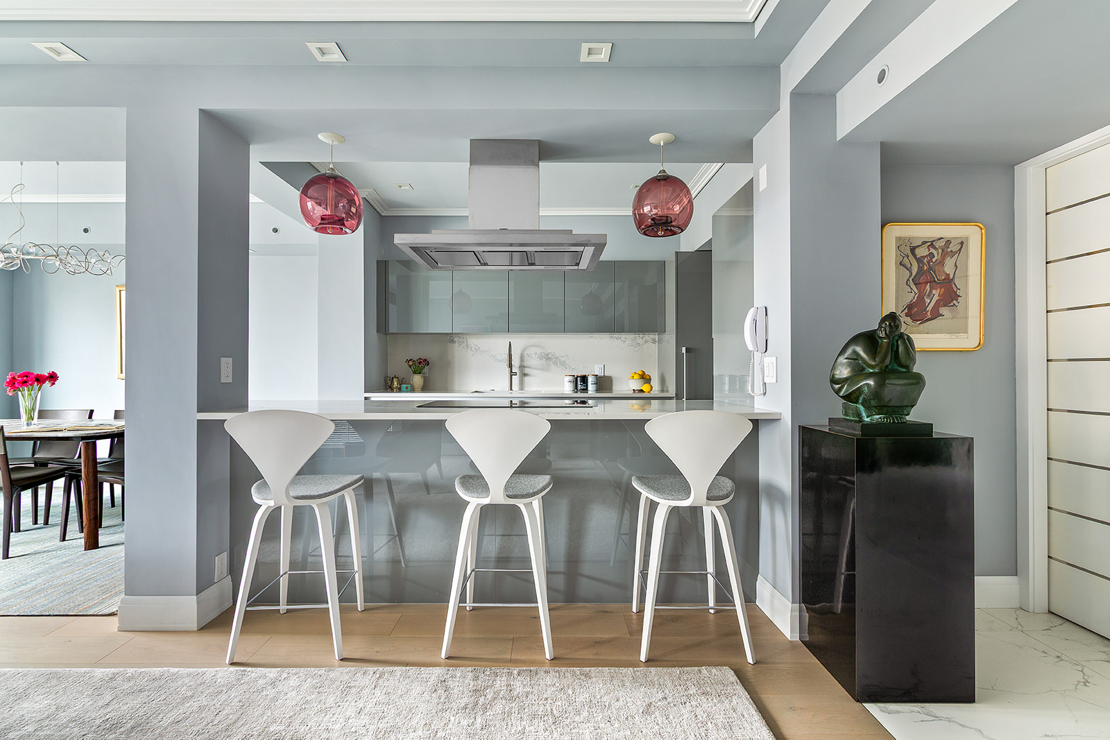 165 East 72nd Street, Unit 17L Manhattan, NY 10021 - Photo 3 of 12 a dinning room with granite countertop kitchen island stainless steel appliances counter space and chair