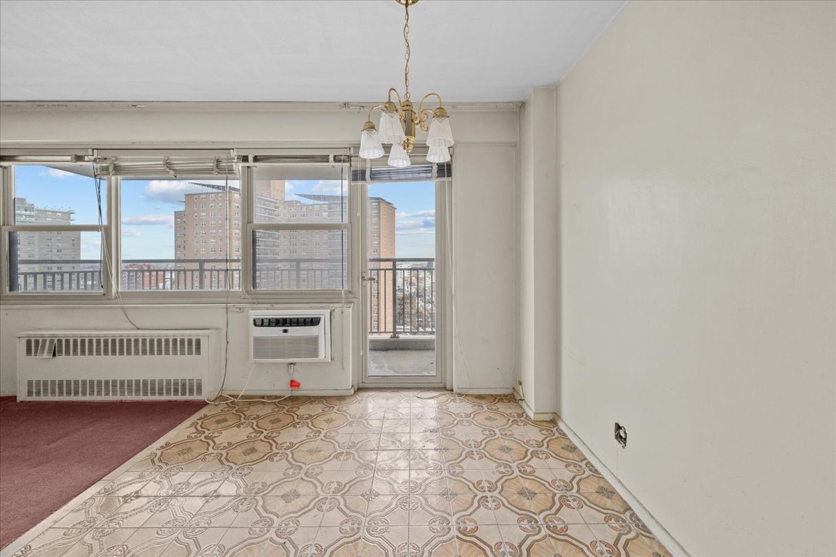 448 Neptune Avenue, Unit 16K Brooklyn, NY 11224 - Photo 5 of 28 a bedroom with a bed and a window