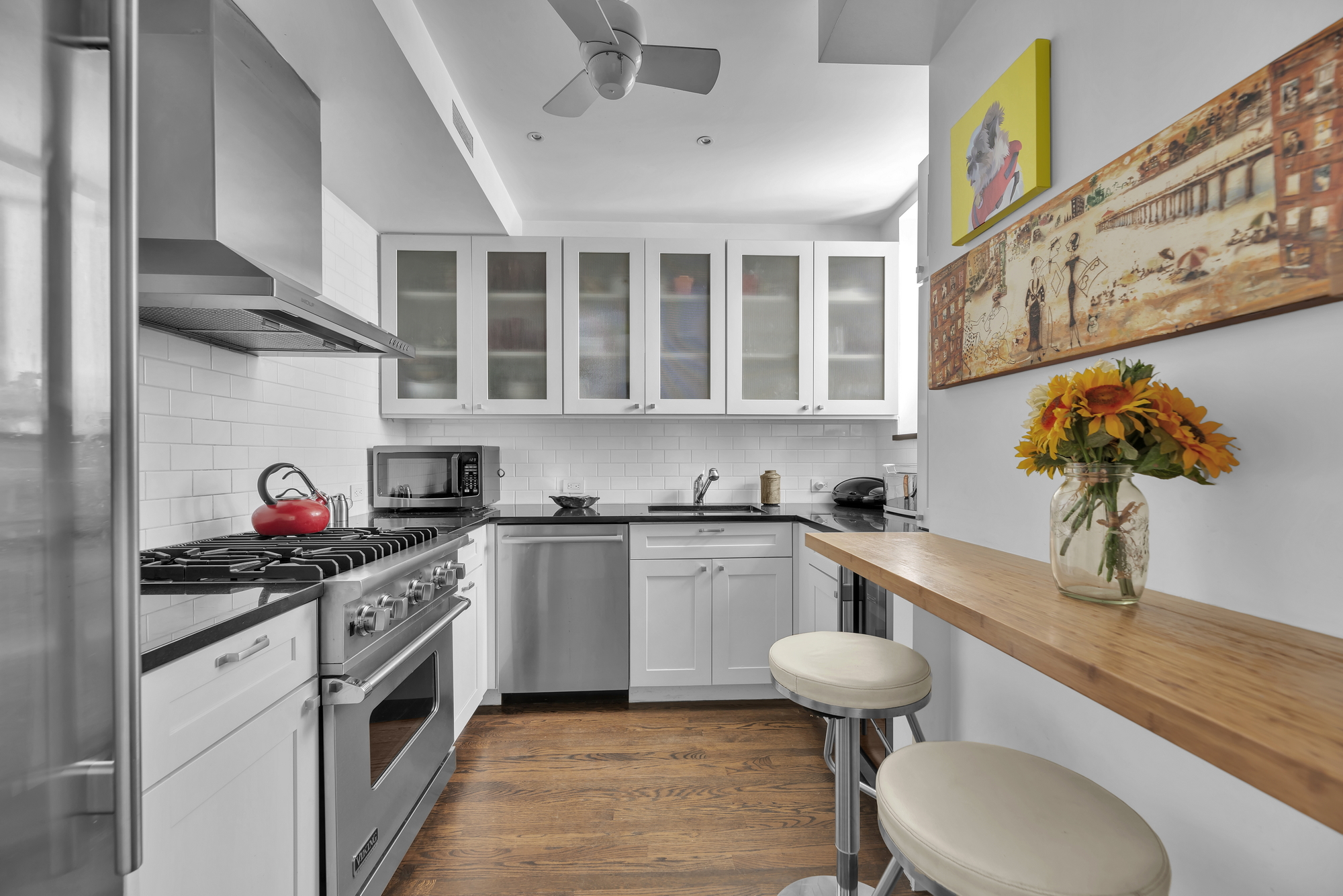 330 West End Avenue, Unit 2B Manhattan, NY 10023 - Photo 7 of 14 a kitchen with stainless steel appliances a stove a sink and a refrigerator