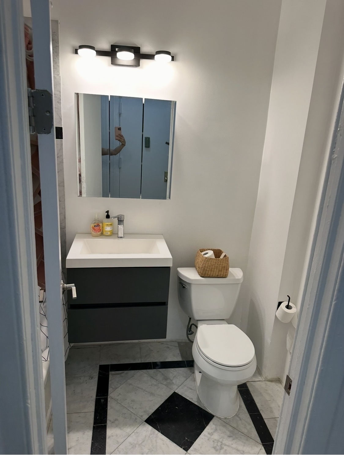 114 East 37th Street, Unit 3A Manhattan, NY 10016 - Photo 14 of 15 a bathroom with a sink a toilet and a mirror
