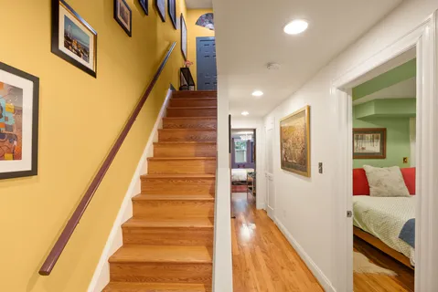 a view of a chairs and table in the balcony