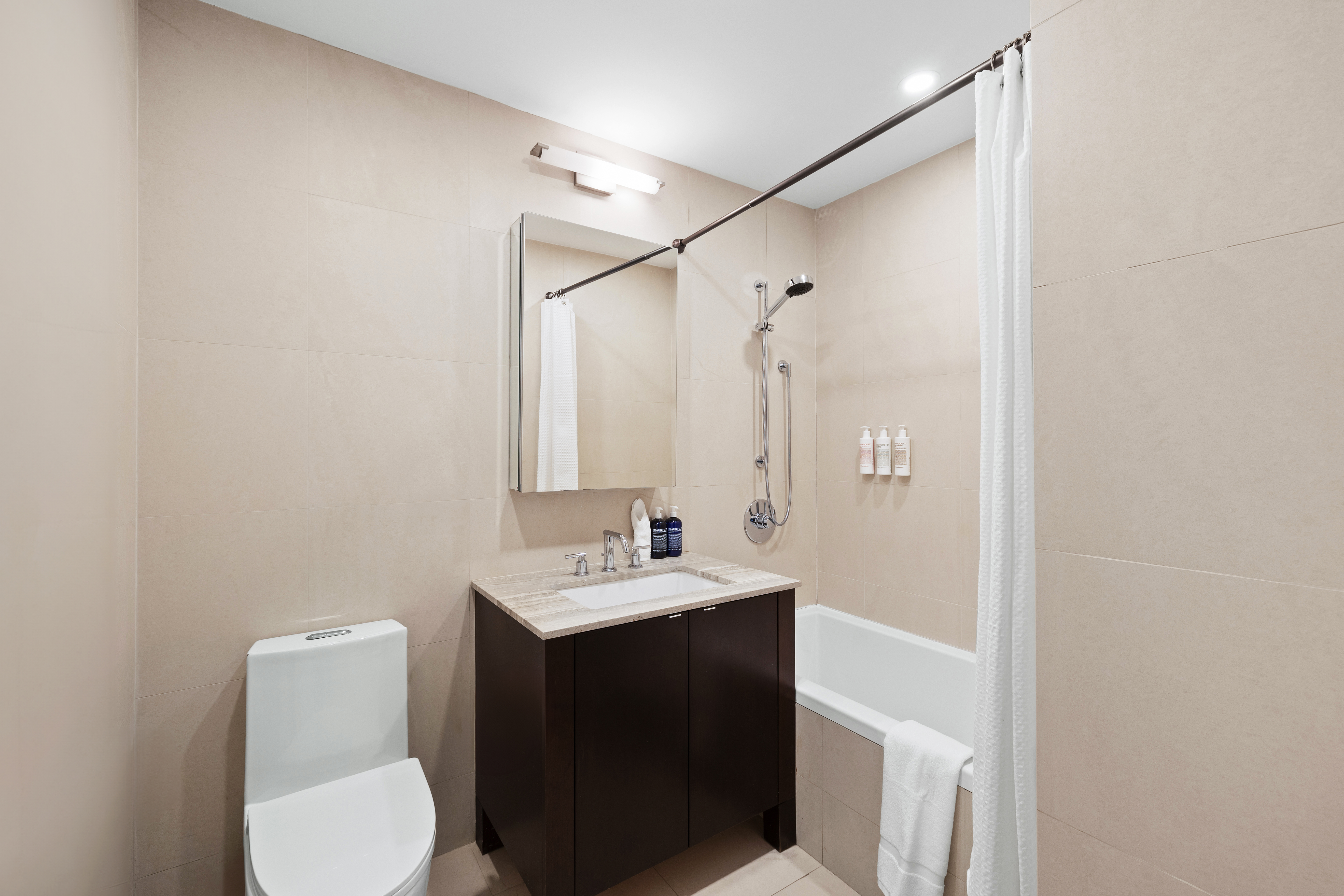 129 West 123rd Street, Unit 3 Manhattan, NY 10027 - Photo 14 of 20 a bathroom with a sink toilet and mirror