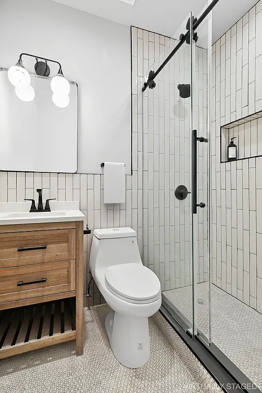 1265 Madison Street, Unit 2 Brooklyn, NY 11221 - Photo 7 of 9 a bathroom with a sink toilet and shower