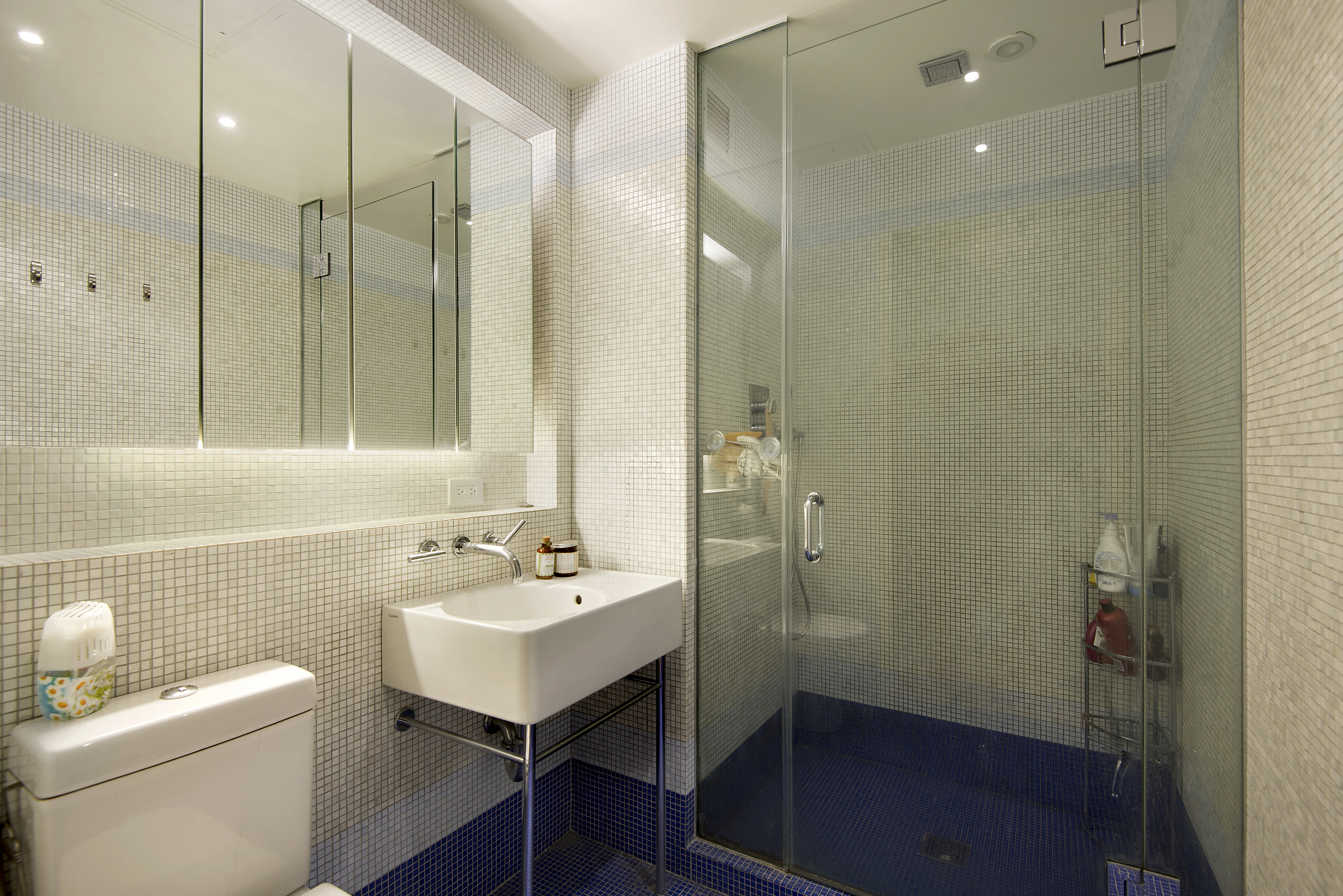 16 West 19th Street, Unit 3A Manhattan, NY 10011 - Photo 4 of 8 a bathroom with a sink a toilet and shower