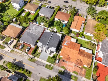an aerial view of a house with a yard