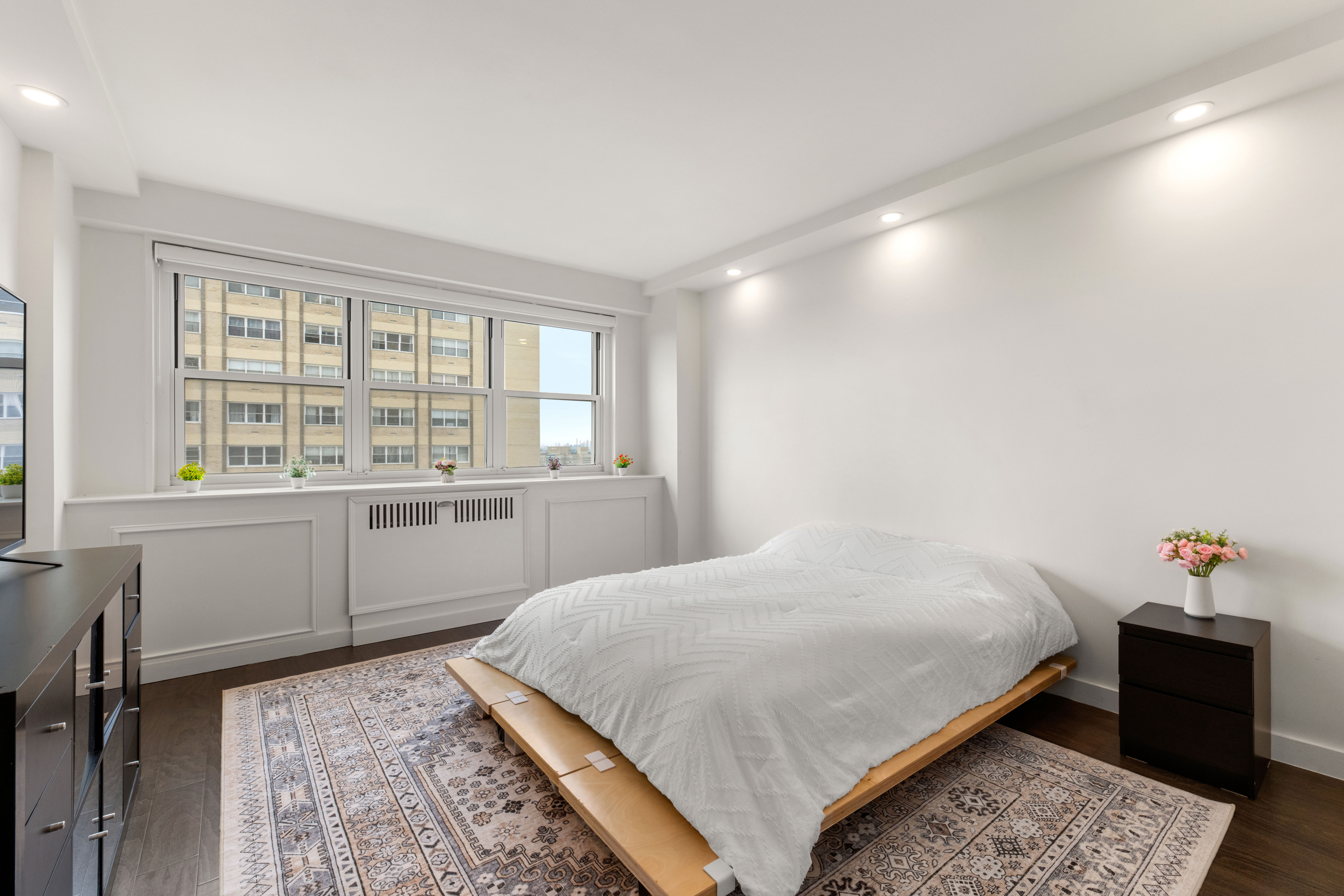 66-36 Yellowstone Boulevard, Unit 24A Queens, NY 11375 - Photo 9 of 20 a bedroom with a bed and a window