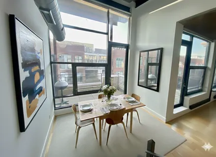 a dining room with furniture and window
