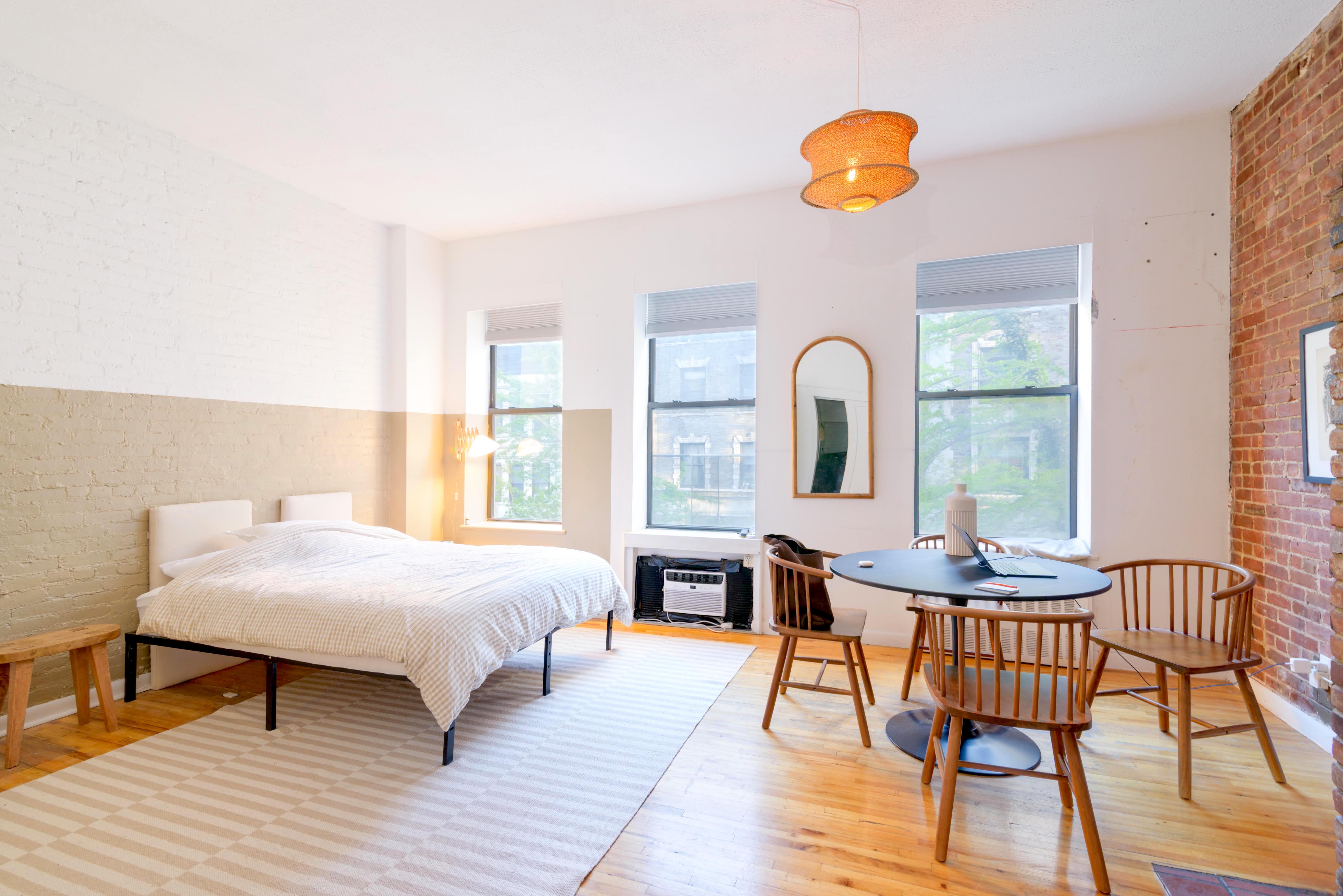 349 West 71st Street Manhattan, NY 10023 - Photo 14 of 21 a bedroom with a bed and a table