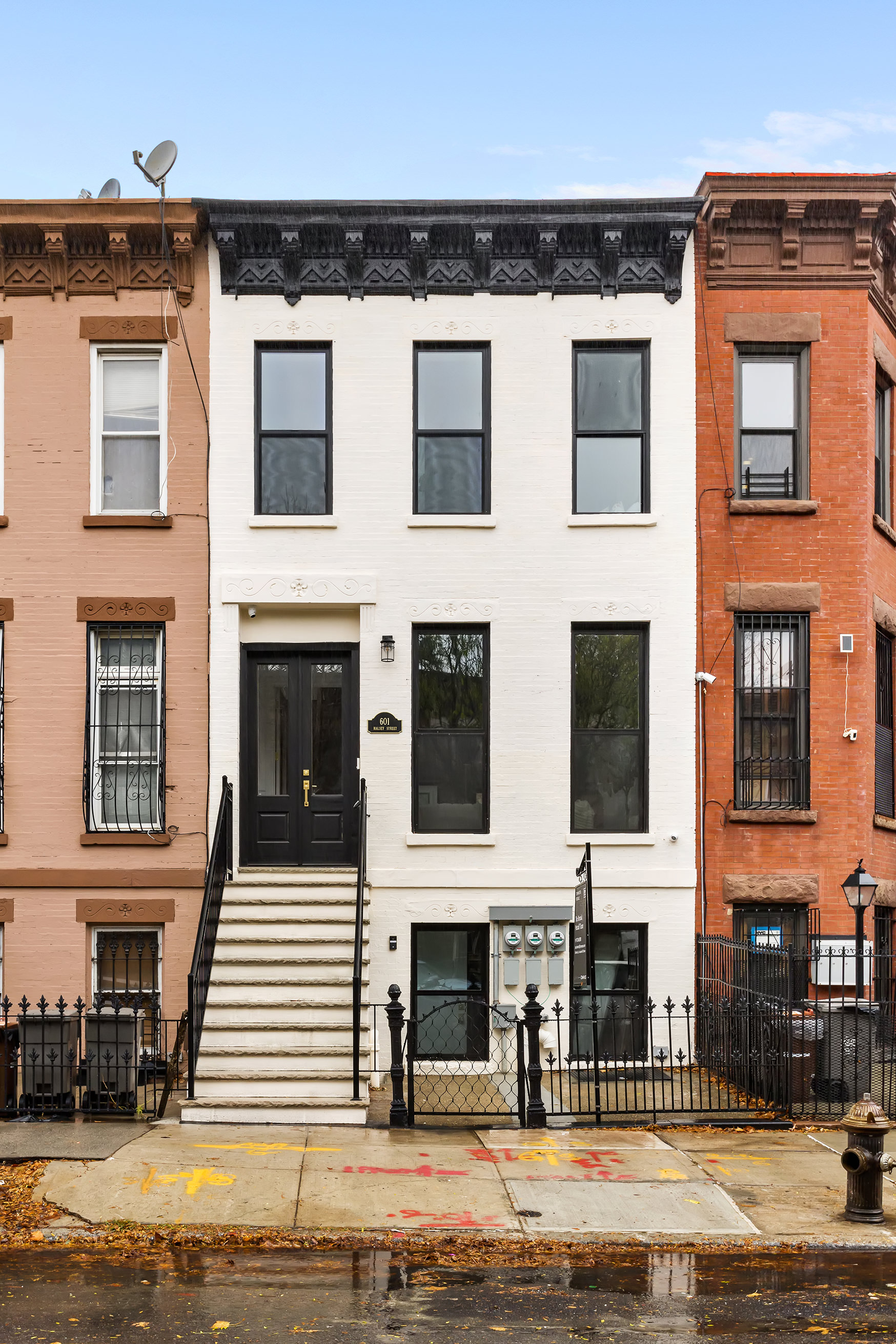 601 Halsey Street Brooklyn, NY 11233 - Photo 12 of 14 a front view of a house with a yard