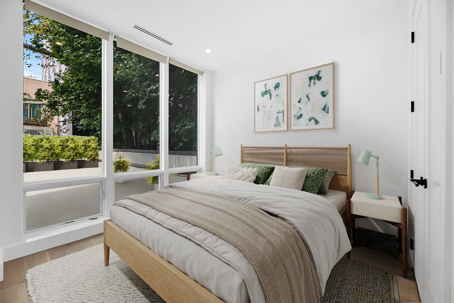 a bedroom with a large bed and a large window