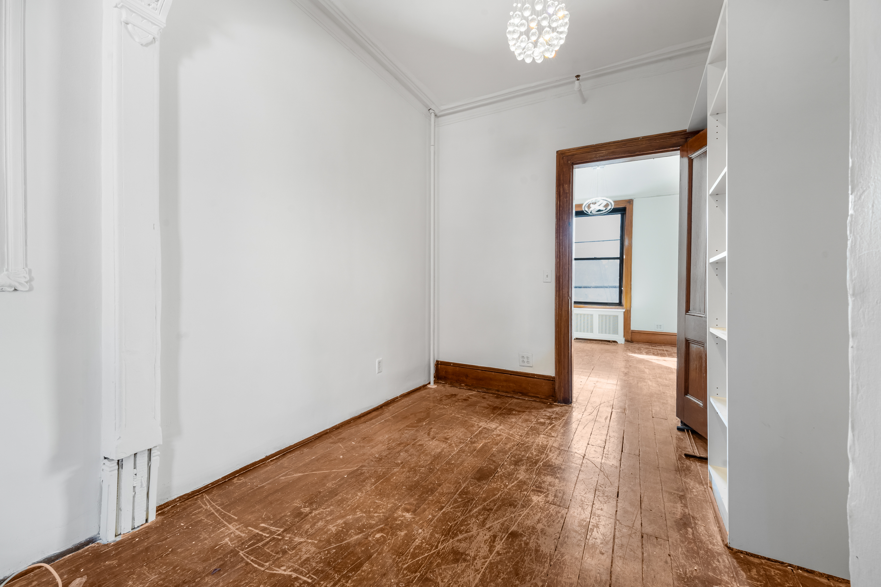 458 West 153rd Street Manhattan, NY 10031 - Photo 10 of 21 a view of an empty room and wooden floor